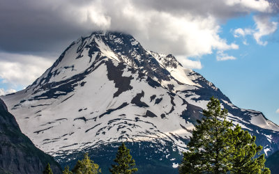 Mount Jackson peak enveloped by clouds in Glacier National Park