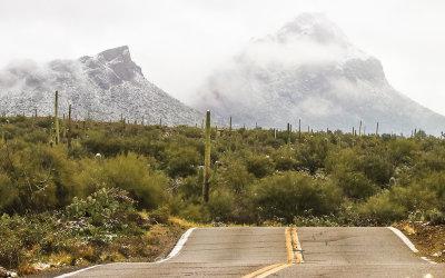 Cat Mountain cloaked in clouds as viewed from Kinney Road in Tucson Mountain Park