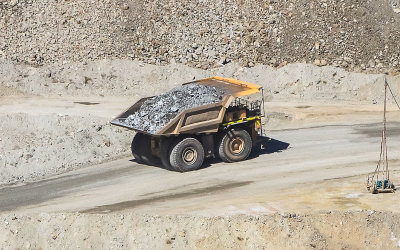 A haul truck removes a load of ore rock from the ASARCO Copper Mine