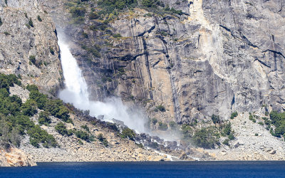 Wapama Falls flowing into the reservoir in the Hetch Hetchy Valley of Yosemite NP