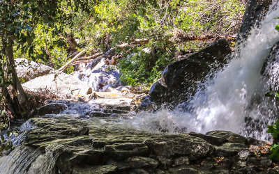 Water from Tueeulala Falls floods the Wapama Falls Trail in the Hetch Hetchy Valley of Yosemite NP