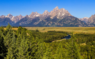 The Snake River flows through the valley below the Teton Mountains in Grand Teton National Park