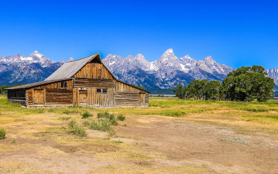 T.A. Moulton Barn along Mormon Row with the Grand Teton Range in the distance in Grand Teton National Park