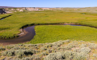 A creek winds its way through the Hayden Valley in Yellowstone National Park