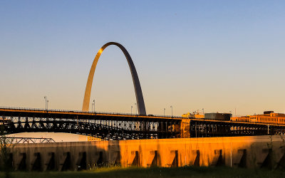 Sunrise lights the Eads Bridge and Gateway Arch from East St. Louis Illinois