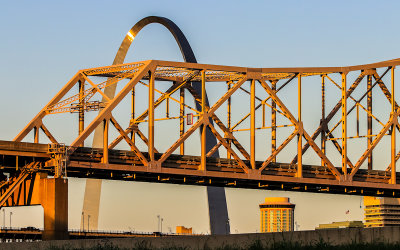 Gateway Arch and the Martin Luther King Bridge in early morning light from East St. Louis Illinois