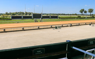 Grandstand view of the track and LED tote board at the Keeneland Race Course