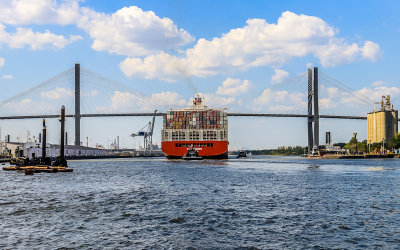 Containership passing under the Talmadge Memorial Bridge spanning the Savannah River in Coastal Georgia