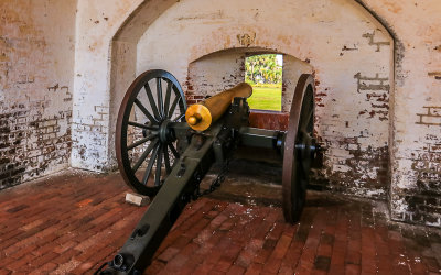 Cannon ready to fire through a cannon wall port in Fort Pulaski National Monument