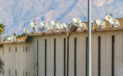 Satellite dish antenna farm on an apartment building in Tucson Arizona