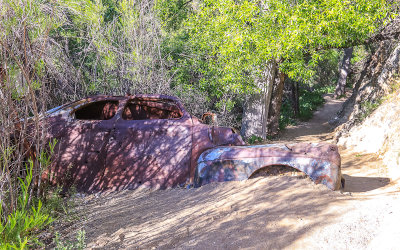 Rusting car along the trail in Morongo Canyon in Sand to Snow National Monument in Southern California