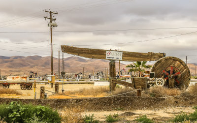 Historical oil well pump in an oil field along California Highway 33
