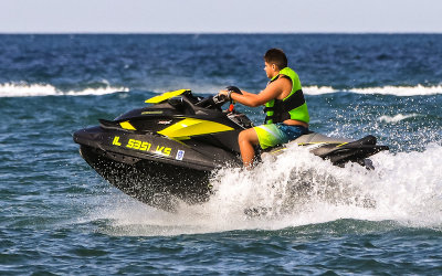 Boy on a Seadoo in Lake Michigan just off shore of Indiana Dunes National Park
