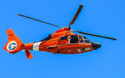 US Coast Guard helicopter flies along the coast of Anastasia State Park in Florida