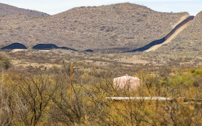 The border wall snakes through the desert in the Arizona Border Zone