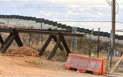 Relic border protection apparatus with the border wall in the distance in the Arizona Border Zone