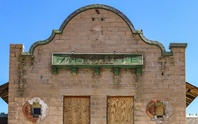 Sign indicating the many lives of the building in the Rhyolite Historic Townsite