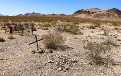 Mountains frame the Rhyolite cemetery in the Rhyolite Historic Townsite