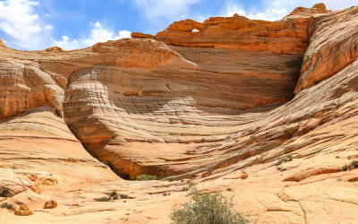 Sandstone formations and arch above The Wave in Vermilion Cliffs National Monument