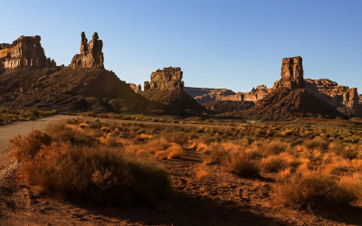 The Rudolph and Santa Claus formation, Stagecoach Rock and Castle Butte as the sun sets in Valley of the Gods