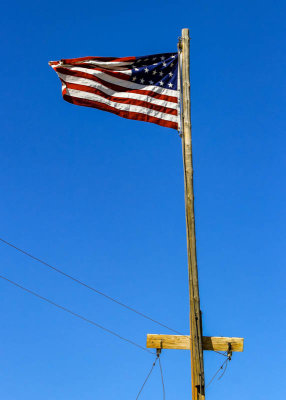 Twenty-star flag flying on a telegraph pole over the Last Spike Site in Golden Spike NHP