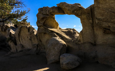 Window Arch backlit by morning light in City of Rocks National Reserve