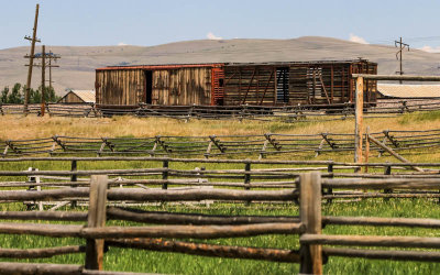 Railroad cars sit on the tracks which pass through the ranch in Grant-Kohrs Ranch NHS