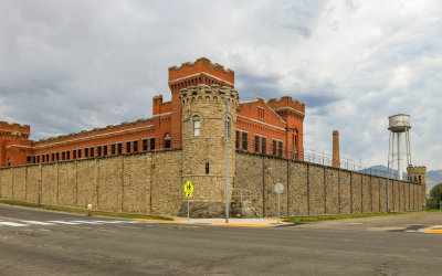 Red brick Cell House within the walls of the prison in the Old Montana Prison