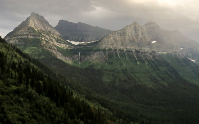 Rain falls on Mount Oberlin and Mount Cannon in Glacier National Park