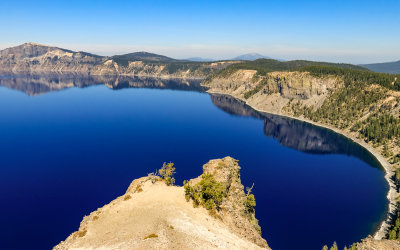 The calm, deep blue waters of Crater Lake in Crater Lake National Park