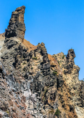 Jagged rock formation on the edge of Crater Lake in Crater Lake National Park