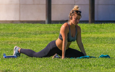 A yoga fan on the grass in front of the Griffith Observatory