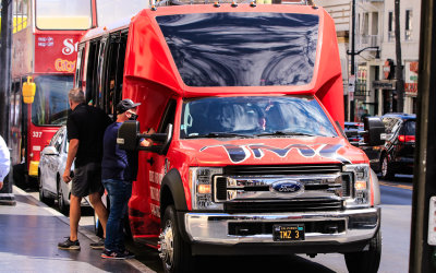 TMZ Tour bus parked along the Hollywood Walk of Fame on Hollywood Boulevard in Hollywood