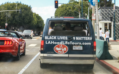 LA Hood Life Tourz van along Rodeo Drive in Beverly Hills