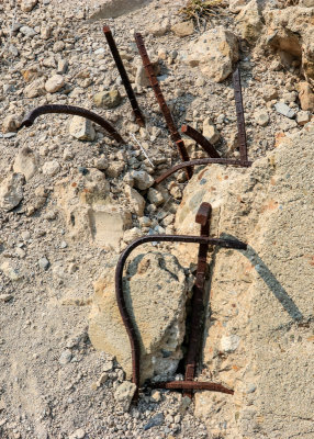Twisted and torn rebar protruding from cement in St. Francis Dam Disaster National Monument