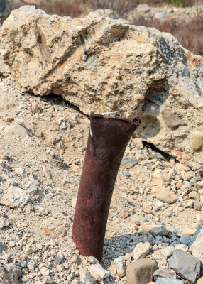 Torn metal pipe juts out of cement in St. Francis Dam Disaster National Monument