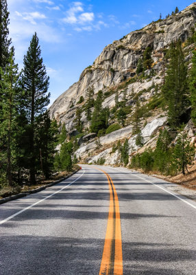 The Tioga Road winds past a granite ridge in Yosemite National Park