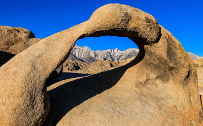 Mount Whitney (14,505 ft) and the Sierra Nevada Range as framed by Mobius Arch in the Alabama Hills National Scenic Area