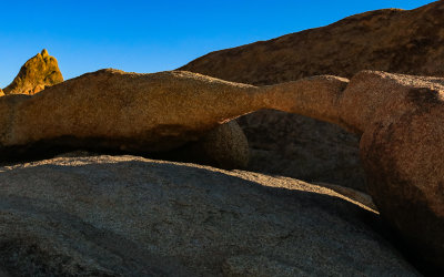 Lathe Arch allowing a sliver of sunlight through in the Alabama Hills National Scenic Area