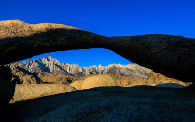 View of the Sierra Nevada Mountain Range through Lathe Arch in the Alabama Hills National Scenic Area