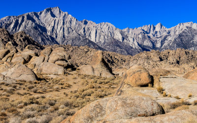 The Sierra Nevada Mountain Range as seen over formations in the Alabama Hills National Scenic Area