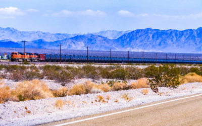 BNSF train passes Amboy California along US Route 66