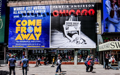 Large Broadway show marquees on Father Duffy Square in Times Square