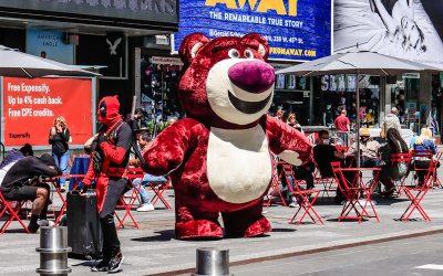 Deadpool and a large fuzzy bear team up in Times Square