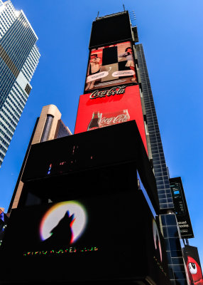 Looking up at the digital billboards in front of Two Times Square in Times Square