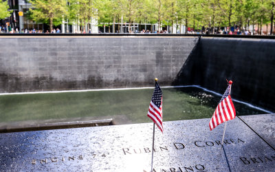 Flags honor the memory of Engine 74 fireman Ruben D. Correa at the 9/11 Memorial Grounds