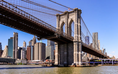 The Brooklyn Bridge frames lower Manhattan from the NYC Boat Tour