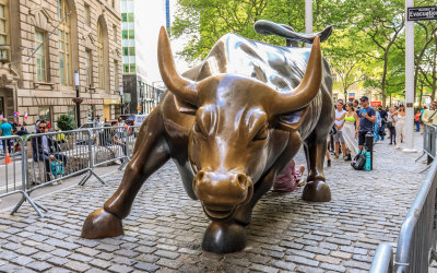 Charging Bull statue coming at you from Wall Street in New York City