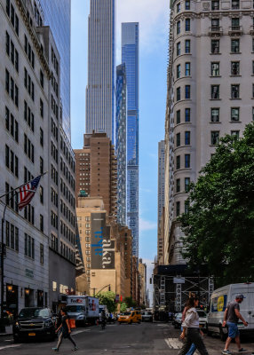 Towering skyscrapers line the street near Central Park in New York City