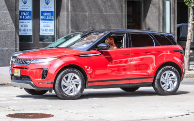 Redheaded Red Range Rover fan rolls rapidly right round through New York City